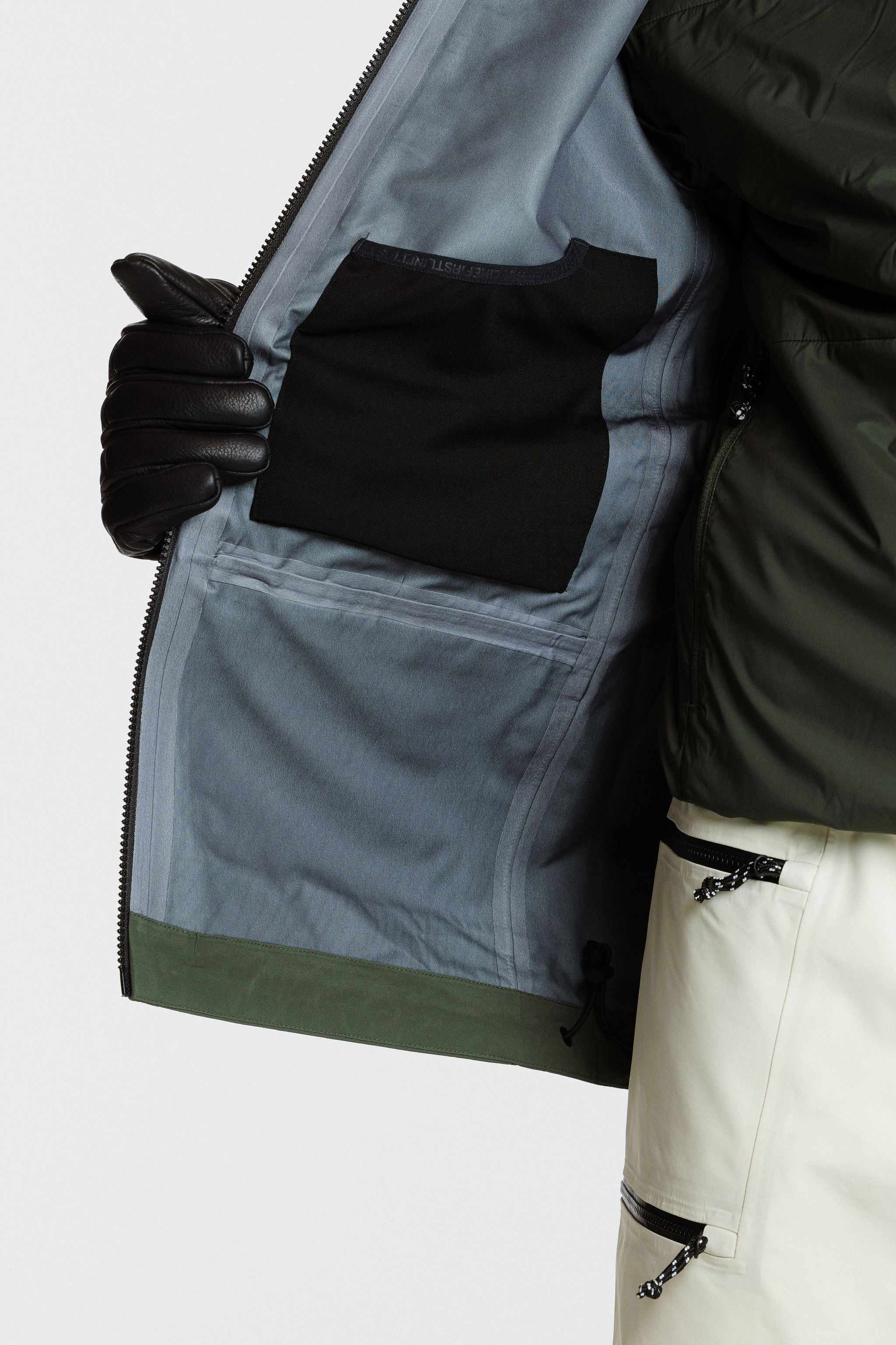 Enjo_3layershelljacket_men_primalolive_frontview_inside meshpocket